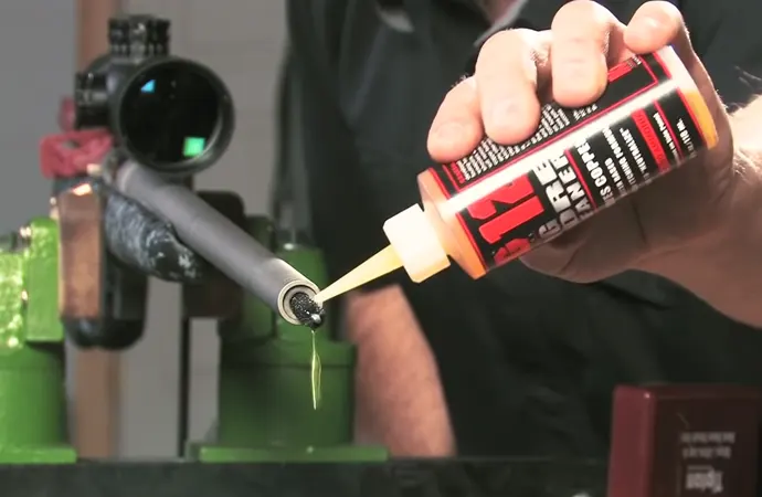 Begin brushing the bore with the bore brush starting at the breech end.