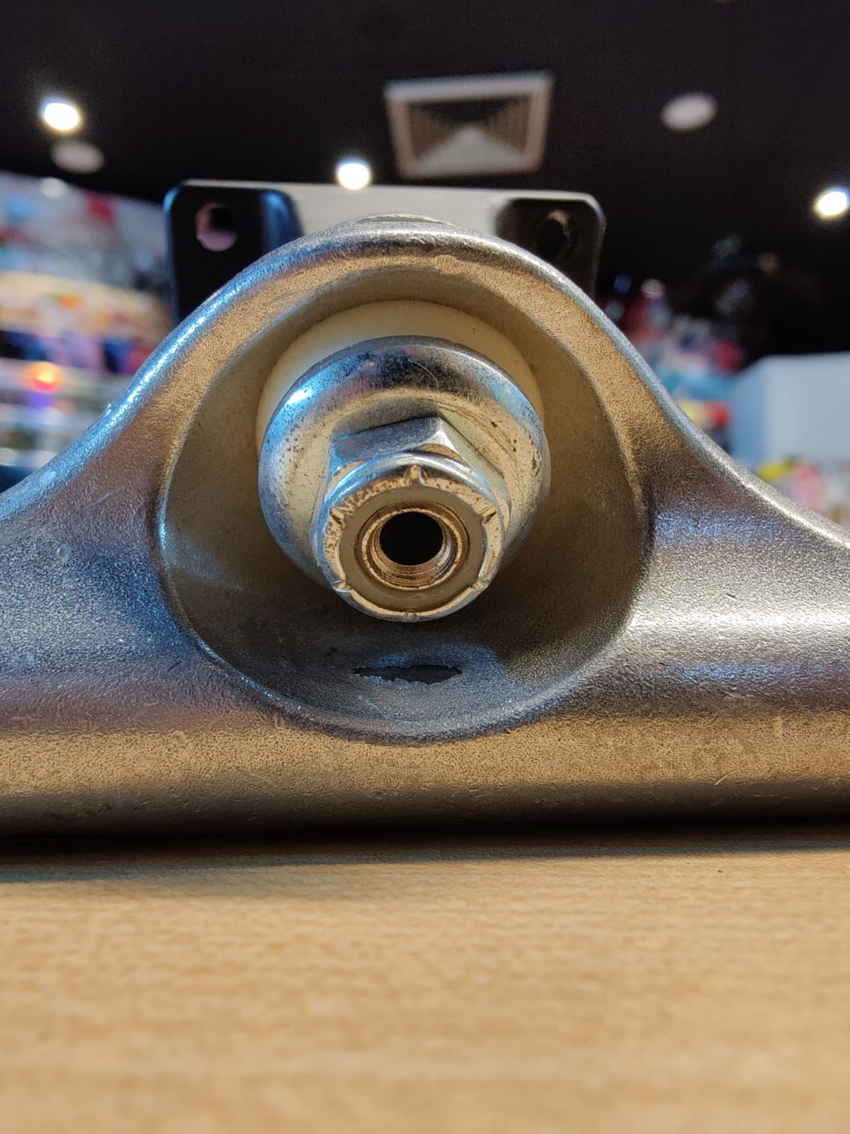 Anatomy of a Skateboard: Uncover the Surprising Secrets! A kingpin is a large bolt nut that controls the amount of pressure put on the bushing. It sticks out of the baseplate.